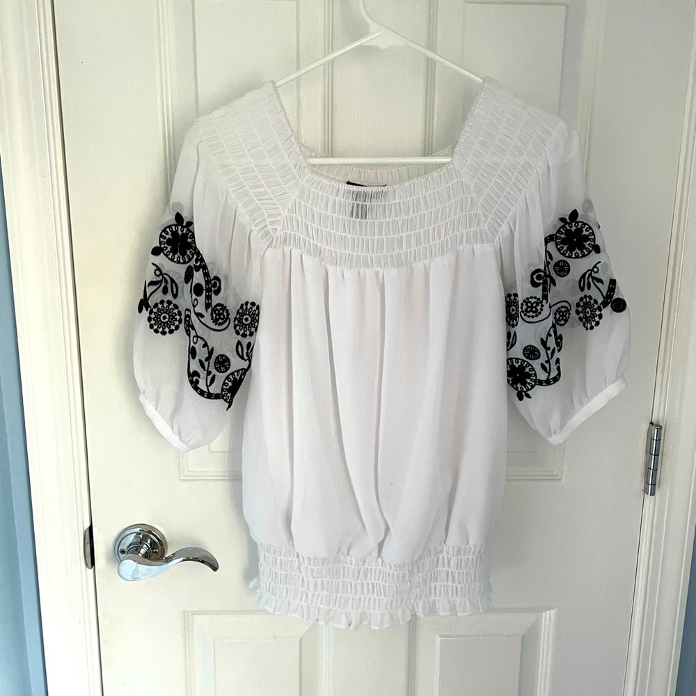 Women’s white short sleeve blouse.